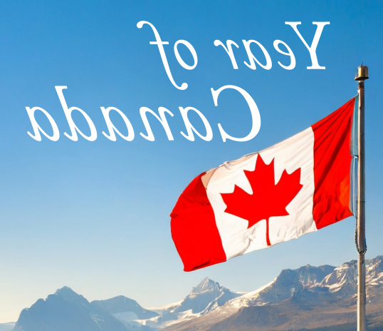 Canadian flag against a blue sky background